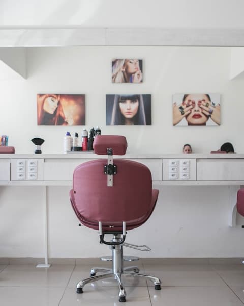 Barbershop interior with vintage leather chairs and ornate mirrors