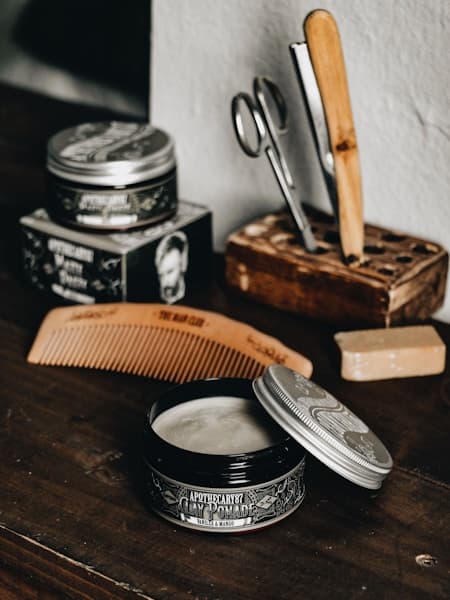 Barbershop exterior with a warm neon sign glowing at dusk