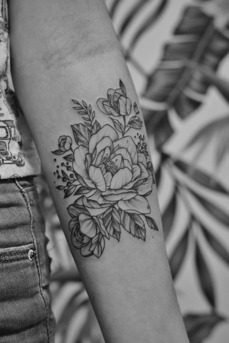 Bold traditional style tattoo on a client's arm with rich colour saturation